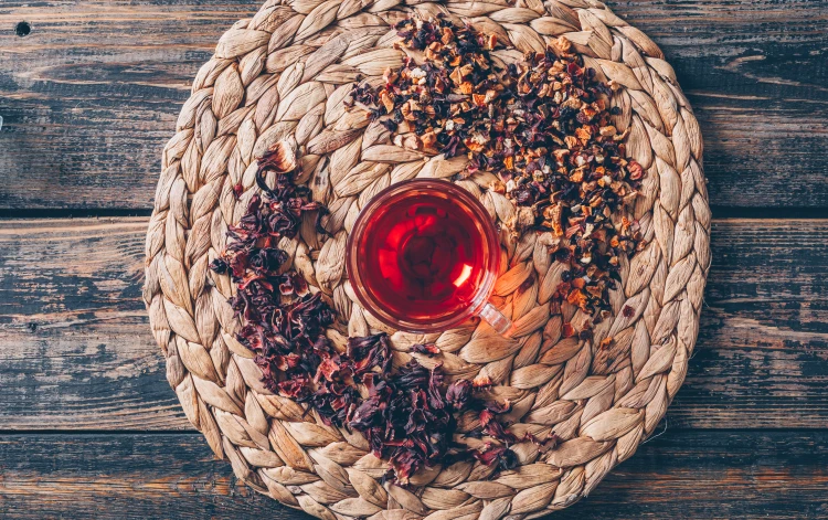 tea-trivet-with-tea-herbs-top-view-dark-wooden-background.jpg